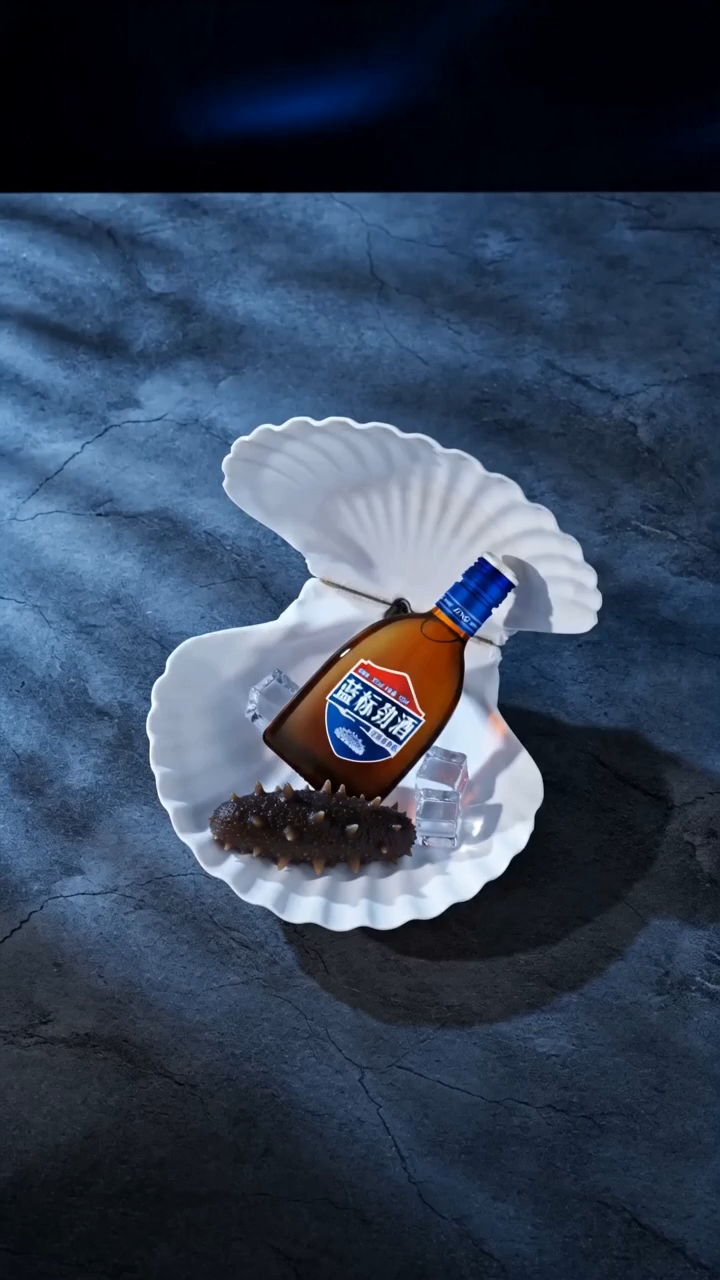 Cold blue waves, smooth pebbles, and a bottle that doesn’t need to stand tall.